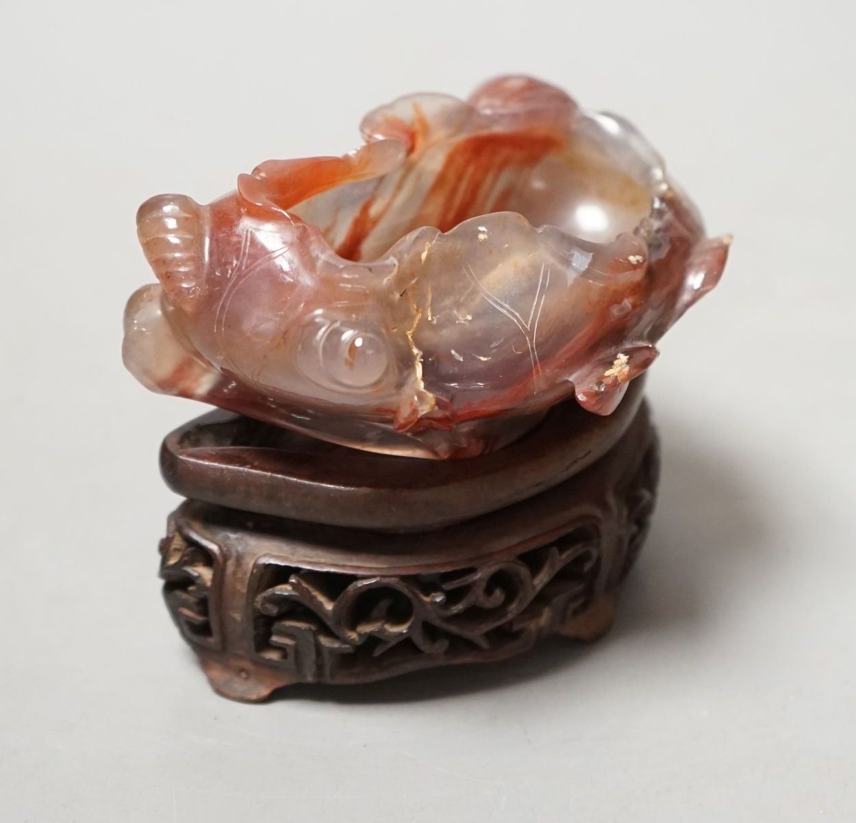 A late 19th / early 20th century Chinese agate brushwasher, wood stand - 8cm tall